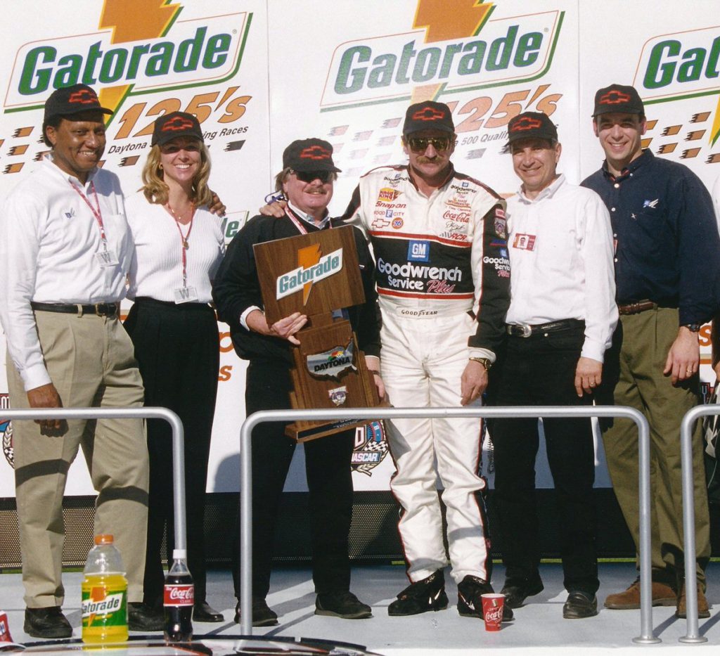Harry Turner standing with Dale Earnhardt during a victory celebration