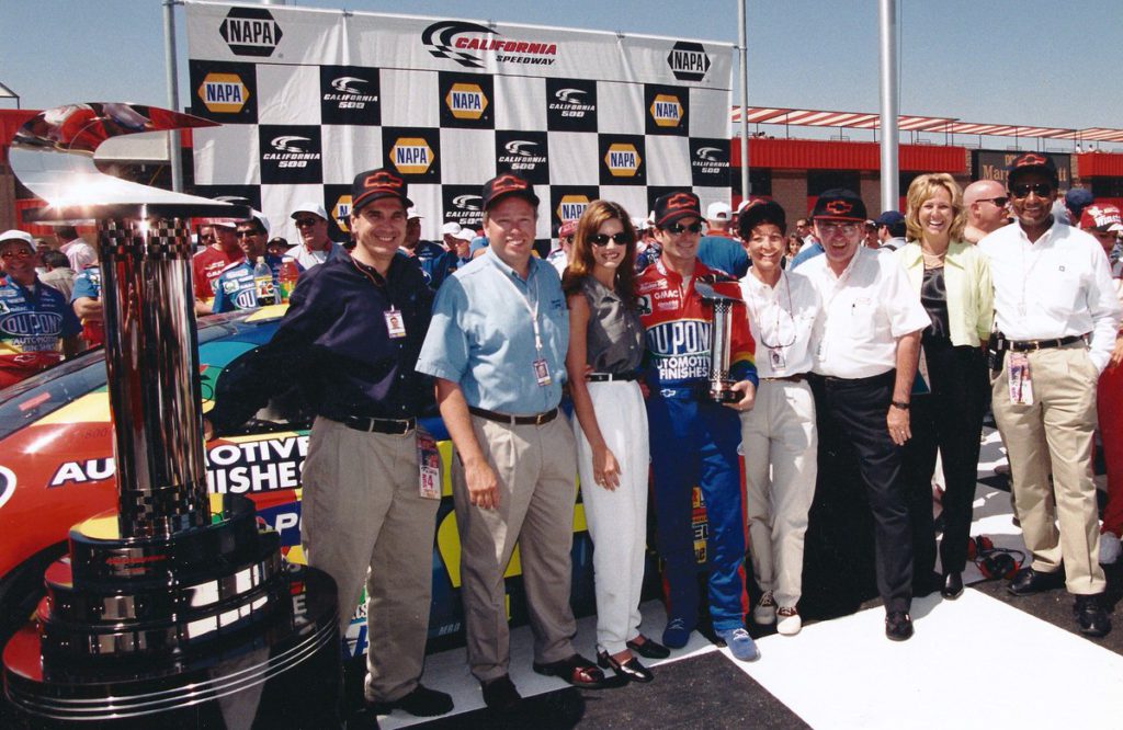 Harry Turner, Jeff Gordon and others celebrate his NASCAR win